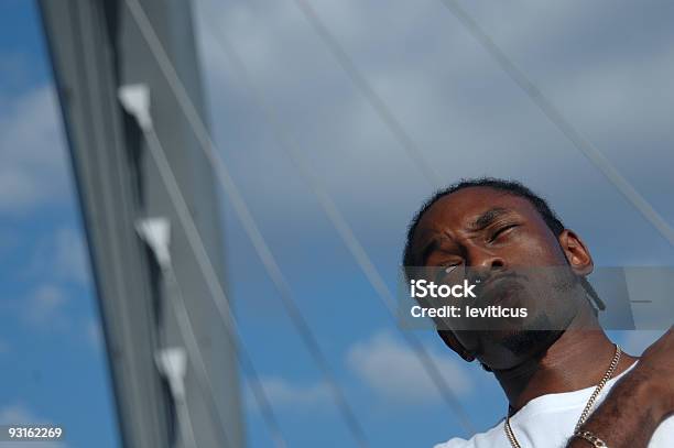 Young Man Squinting At The Future Stock Photo - Download Image Now - Gangsta Rap, Adult, Adults Only