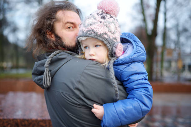 istock Happy young father holding his little daughter 931633572