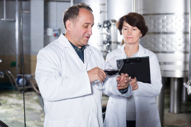 istock Glad wine maker shows to expert equipment 931636828