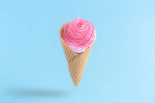 istock Ice cream made of pink and white threads. Summer creative minimal concept. 931637512