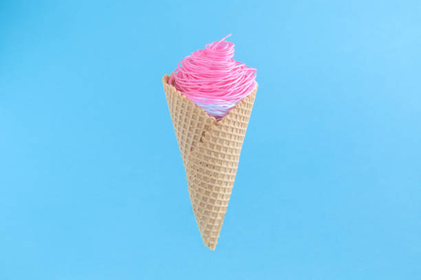 istock Ice cream made of pink and white threads. Summer creative minimal concept. 931637572