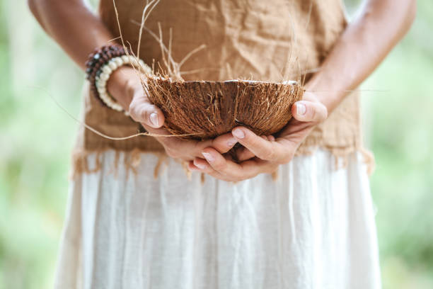 istock Tribal woman with coconut bowl 931637608