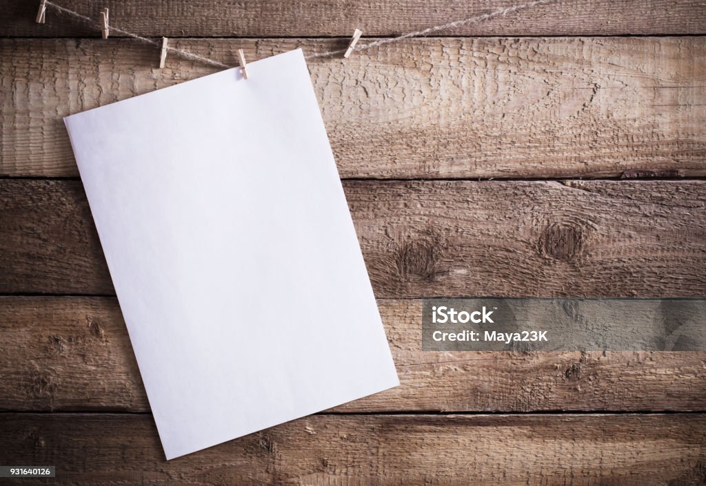 paper on old wooden background Paper Stock Photo