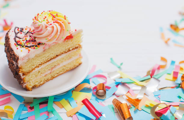 istock birthday cake and  decoration on white wooden background 931640206