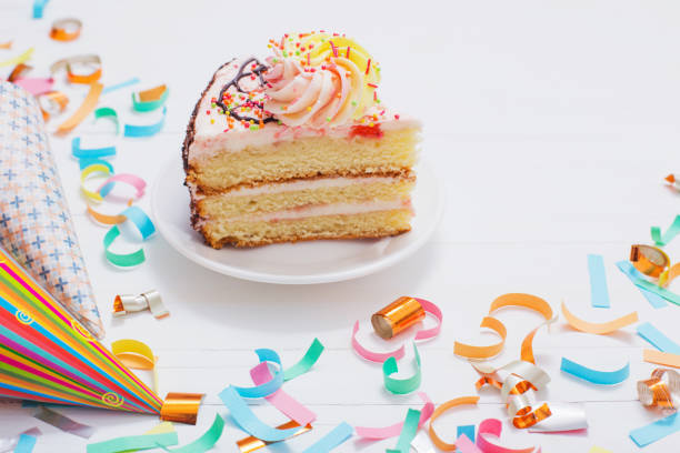 istock birthday cake and  decoration on white wooden background 931640246