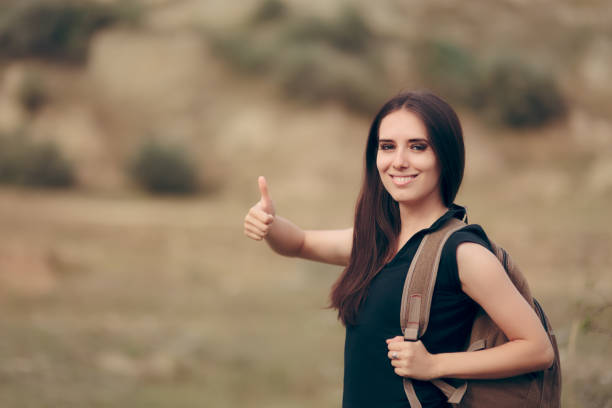 istock Happy Travel Woman With Backpack on a Mountain Trip 931644108