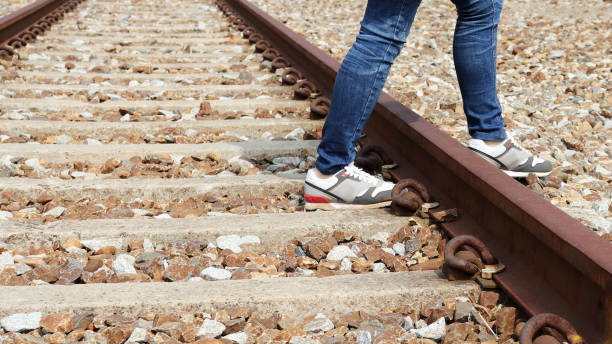 istock The railroad and the legs. 931644946