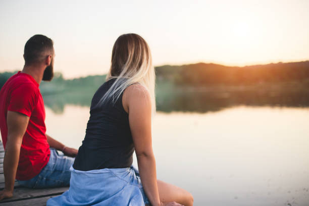 Romantic Couple sitting on the pier