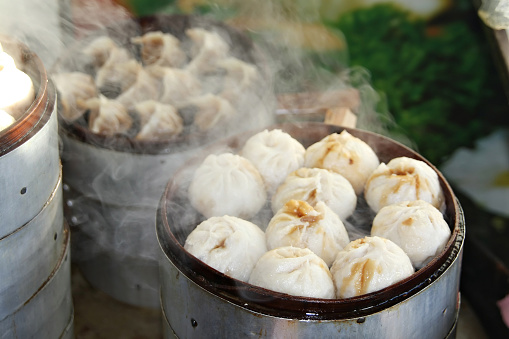 Street food booth selling Chinese specialty Steamed Dumplings in Beijing, China
