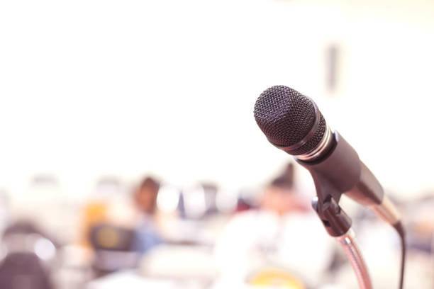 istock Close up microphone in conference on seminar room event background 931657730