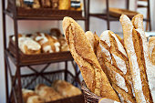 Bread baguettes in basket at baking shop