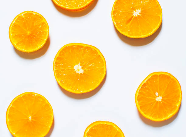 istock Slices of orange isolated on white background. top view 931662094