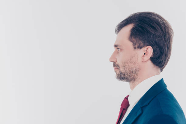 istock Profile side view half-faced portrait of serious confident concentrated focused handsome with beard high temples wearing red tie formal outfit isolated on gray background empty blank copy-space 931663612