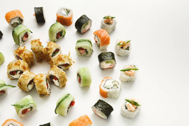 istock Japanese sushi rolls, maki on white background 931663622