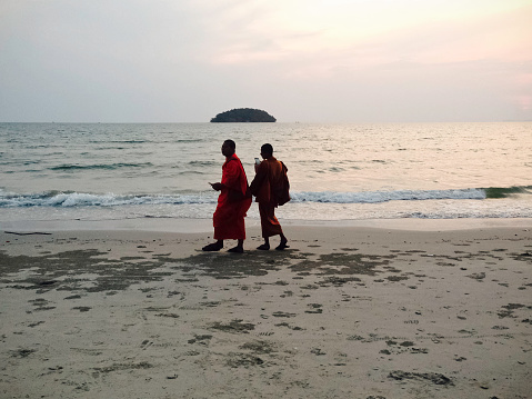 Khu Pho,Vietnam,12/03/2018; buddhist monks an afternnon to the Kho Pho territory,walking together on the sand.