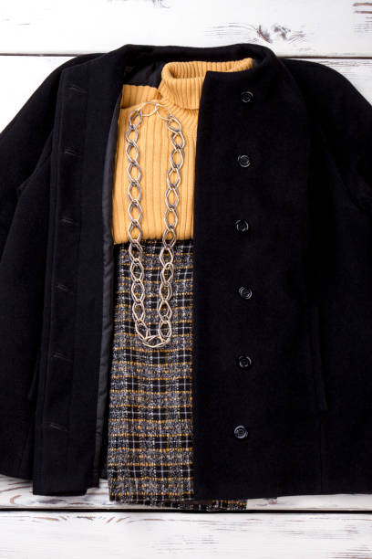 istock Folded winter outfit with chain necklace. 931682470