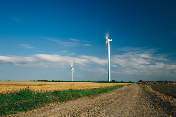 istock Wind turbines for electrical power generation in agricultural fields. 931683330