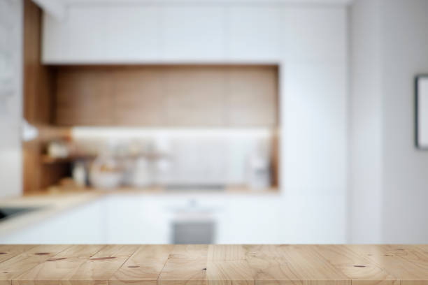 istock Kitchen table top and blur background of cooking zone interior 931683732