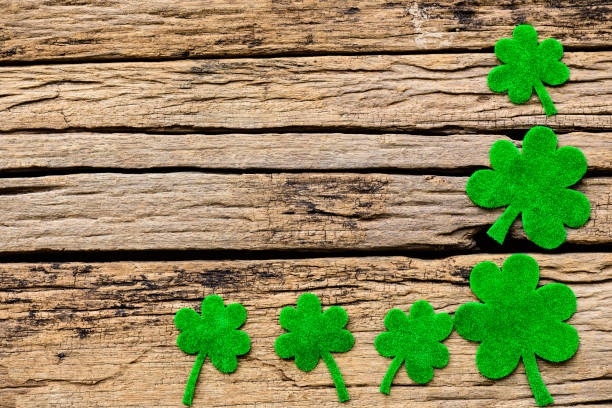 istock Happy St Patricks Day message with green clover leaf on wooden background 931684156