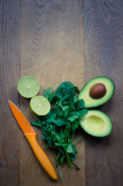 making fresh guacamole with avocado lime and coriander - guacamole food bar vegan food imagens e fotografias de stock