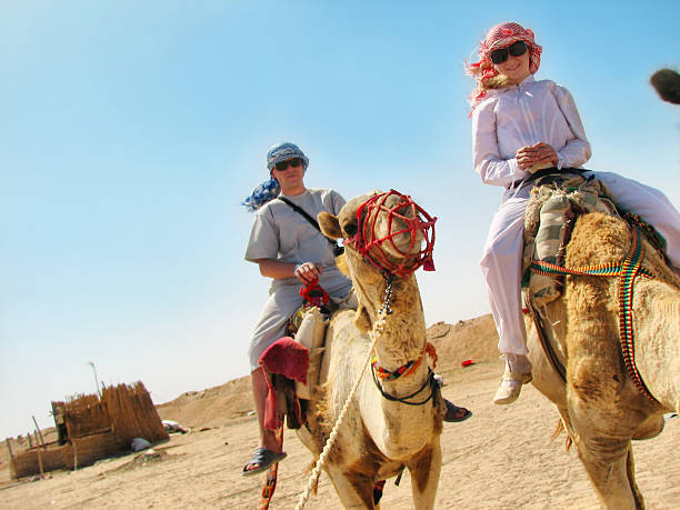 istock Adults traveling on camels in Egypt 93168769