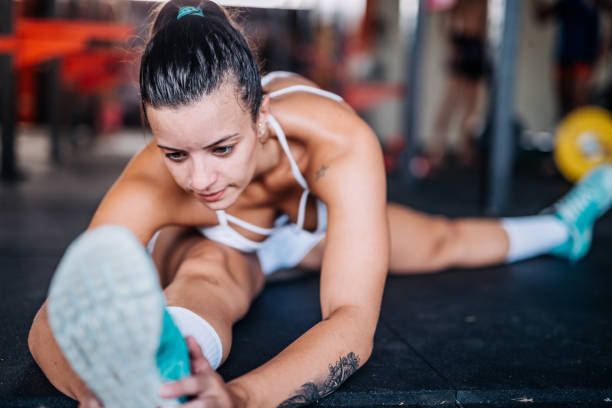 istock Beautiful Latino woman doing splits on training 931692956