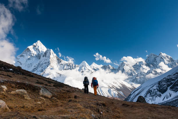istock Trekkers approaching Amadablan mount in Khumbu valley on a way to Namche Bazar 931693110