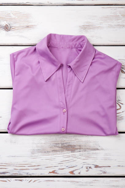 istock Folded purple women shirt. 931693904