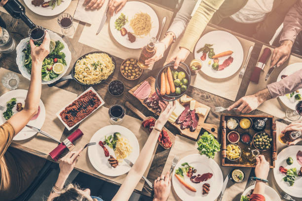istock Group of people having meal togetherness dining 931697120