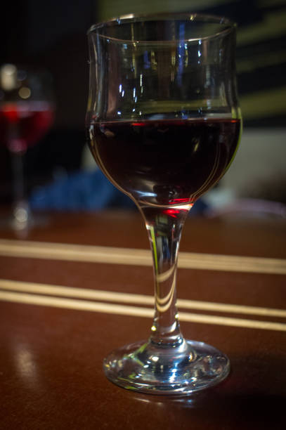 istock Pouring red wine into the glass 931697166