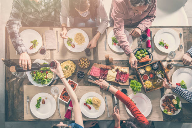 istock Group of people having meal togetherness dining 931697532