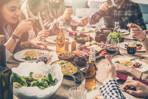 Group of people having meal togetherness dining