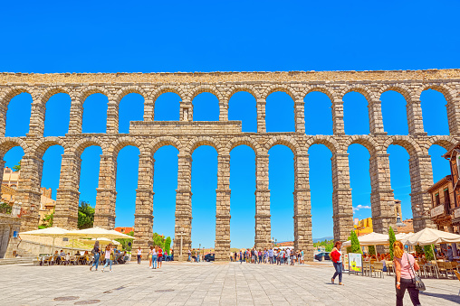 Segovia, Spain- June 07, 2017: Aqueduct of Segovia (or more precisely, the aqueduct bridge) is a Roman aqueduct in Segovia. Segovia  were declared World Heritage Sites by UNESCO.