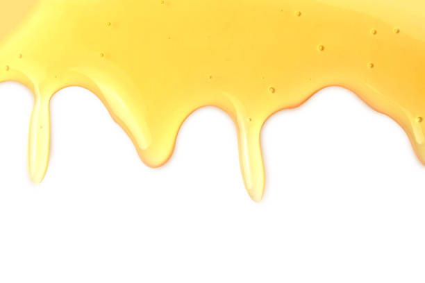 istock Macro close up lava honey drops isolated on white and text copy space. Using idea design background or wallpaper. 931709800