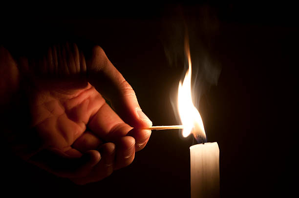 istock Men is firing a candle 93171604
