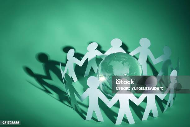 Group Of Paper Men Standing Around The Glass Globe Stock Photo - Download Image Now - Adult, Belarus, Blue