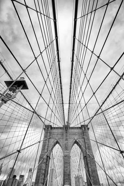 Looking up at the Brooklyn Bridge, New York City. stock photo