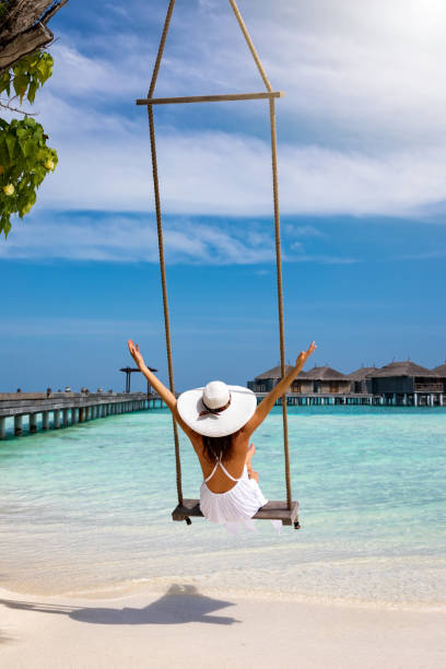 istock Female traveller enjoys her tropical summer vacation 931732798