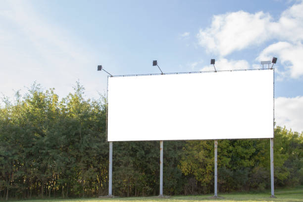 istock Mock up. Horizontal blank billboard outdoors, outdoor advertising, public information board on city road 931734658