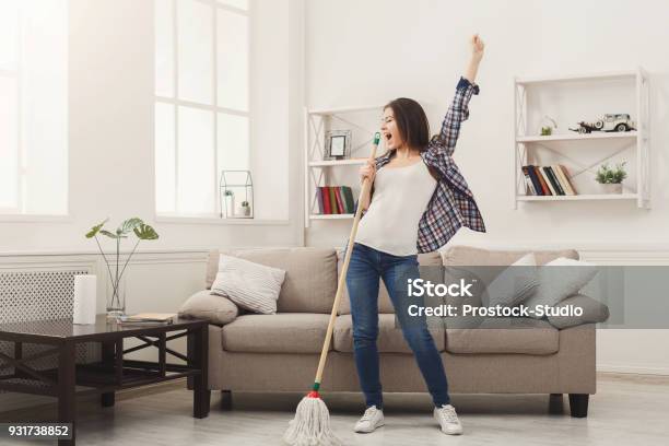 Happy Woman Cleaning Home With Mop And Having Fun Stock Photo - Download Image Now - Cleaning, Domestic Life, Women