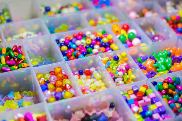 istock many colorful glas pearls in boxes 931739478