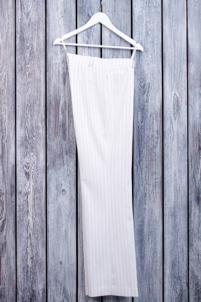 istock White business trousers on hanger. 931741564