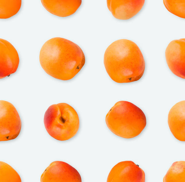 istock Pattern made of apricots, top view, isolated on white 931752662