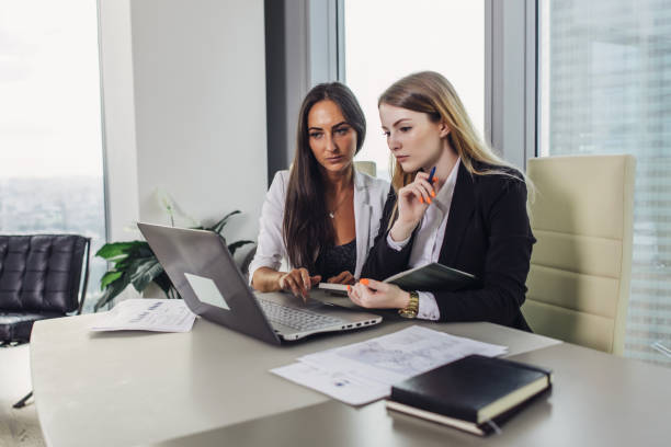 istock Start-up business partners working together on new project sitting at desk surfing internet using laptop 931753482