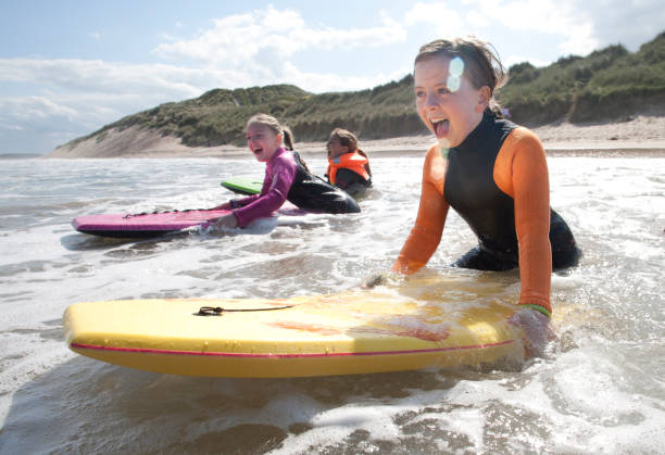 Girls Bodyboarding in the Sea