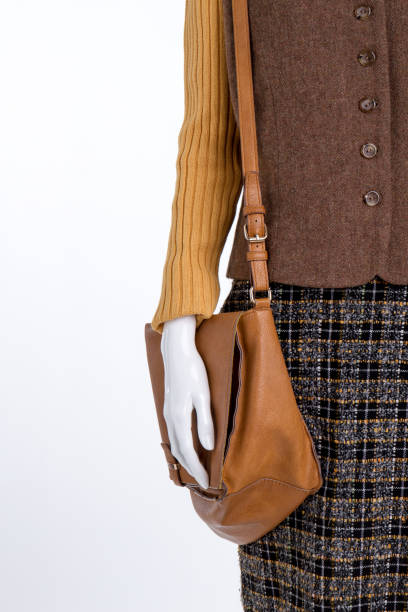istock Brown leather purse and womens clothes. 931757846