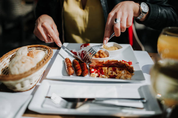 istock Woman having breakfast in cafe 931761354