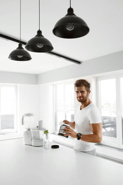 istock Healthy Nutrition. Man Preparing Protein Shake. Food Supplements 931766346