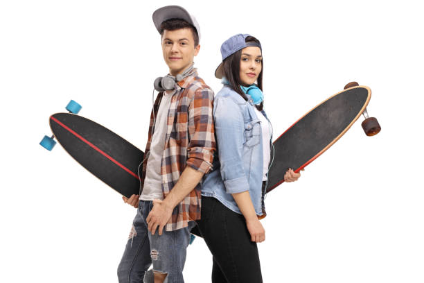 Teenage skaters with longboards with their backs against each other isolated on white background