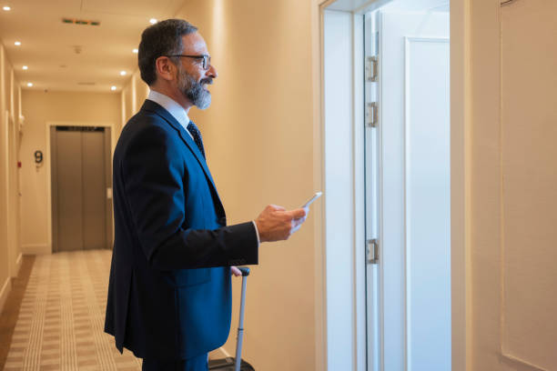 istock Businessman on a business trip at the hotel 931771900